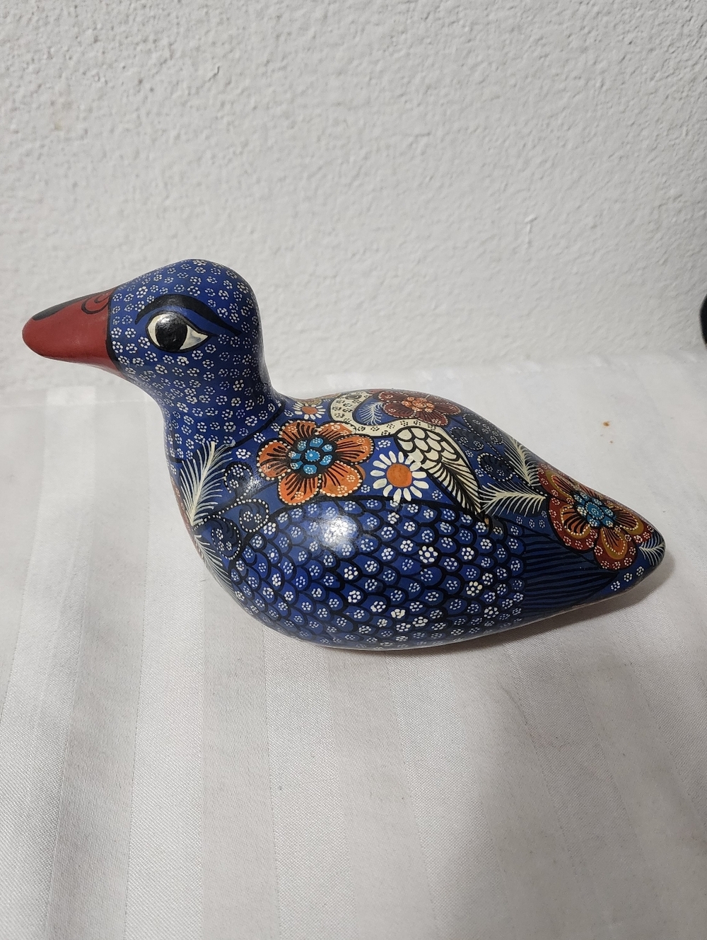 Hand-Painted Blue Ceramic Bird Figurine with Floral Accents